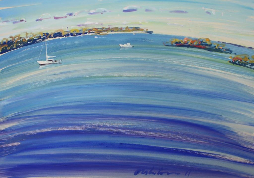 Serene blue water with boats.